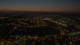 4K aerial stock footage approaching Merrill Field, Downtown Anchorage at night, Alaska Aerial Stock Footage | AK0001_1145