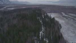 4K aerial stock footage flying over wooded hills near a river, Knik River Valley, Alaska Aerial Stock Footage | AK0001_1226