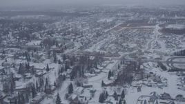 4K aerial stock footage flying over snowy neighborhoods and apartment buildings, Anchorage, Alaska Aerial Stock Footage | AK0001_1323