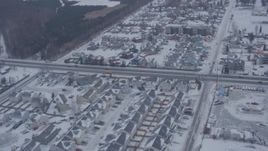 4K aerial stock footage flying over snow covered neighborhoods and roads in Anchorage, Alaska Aerial Stock Footage | AK0001_1324