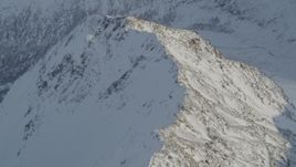 4K aerial stock footage snowy mountain ridge, revealing Knik River Valley, Chugach Mountains, Alaska Aerial Stock Footage | AK0001_1373