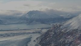 4K aerial stock footage Inner Lake George between Knik Glacier and Chugach Mountains in snow, Alaska Aerial Stock Footage | AK0001_1383