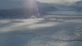 4K aerial stock footage pan camera left along Knik Glacier to Chugach Mountains in snow, Alaska Aerial Stock Footage | AK0001_1384