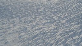 4K aerial stock footage the surface of the snow covered Knik Glacier, Alaska Aerial Stock Footage | AK0001_1387