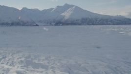 4K aerial stock footage flying across surface of snow covered Knik Glacier, Alaska Aerial Stock Footage | AK0001_1390