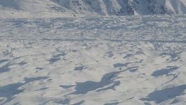 4K aerial stock footage the surface of the snow covered Knik Glacier, Alaska Aerial Stock Footage | AK0001_1397