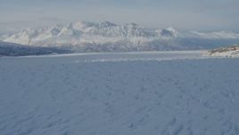 4K aerial stock footage flying across surface of snow covered Knik Glacier, Alaska Aerial Stock Footage | AK0001_1404
