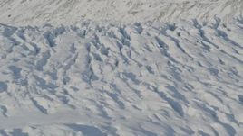 4K aerial stock footage the cracked, snow covered surface of the Knik Glacier, Alaska Aerial Stock Footage | AK0001_1406