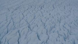 4K aerial stock footage the cracked, snow covered surface of the Knik Glacier, Alaska Aerial Stock Footage | AK0001_1409