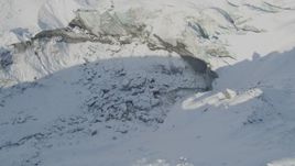 4K aerial stock footage broken ice in snow covered indentation in the Knik Glacier, Alaska Aerial Stock Footage | AK0001_1412