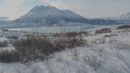 4K aerial stock footage video flying over the snow covered Knik Glacier revealing Inner Lake George, Alaska Aerial Stock Footage | AK0001_1432