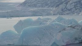 4K aerial stock footage orbiting a chunk of glacial ice in Inner Lake George, Alaska in snow Aerial Stock Footage | AK0001_1433