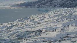 4K aerial stock footage flying over surface of snow covered glacier on Inner Lake George, Alaska Aerial Stock Footage | AK0001_1451