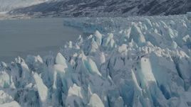 4K aerial stock footage flying over jagged, snowy surface of glacier on Inner Lake George, Alaska Aerial Stock Footage | AK0001_1453