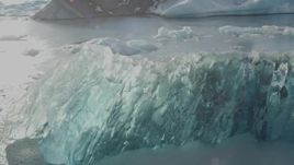 4K aerial stock footage flyby blue glacial ice on Inner Lake George, Alaska in snow Aerial Stock Footage | AK0001_1461