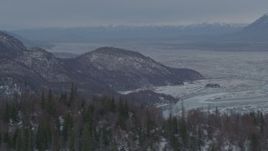 4K aerial stock footage the snow covered Knik River Valley seen from the Chugach Mountains, Alaska Aerial Stock Footage | AK0001_1484