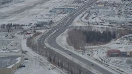 4K aerial stock footage Glenn Highway, 5th Avenue, snowy Merrill Field, Downtown Anchorage, Alaska Aerial Stock Footage | AK0001_1518