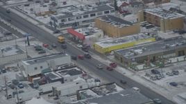 4K aerial stock footage light traffic on East 5th Avenue in Downtown Anchorage, Alaska in snow Aerial Stock Footage | AK0001_1522