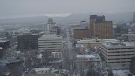 4K aerial stock footage fly over Cook Inlet, West 4th Avenue, snowy Downtown Anchorage, Alaska Aerial Stock Footage | AK0001_1526