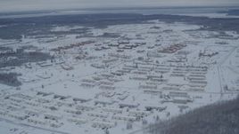 4K aerial stock footage snow covered Fort Richardson residential neighborhoods, Anchorage, Alaska Aerial Stock Footage | AK0001_1530