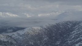 4K aerial stock footage flyby snowy mountain ridges, Eklutna Lake Valley, Chugach Mountains, Alaska Aerial Stock Footage | AK0001_1548