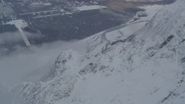 4K aerial stock footage Knik River near Butte seen from snow covered Chugach Mountains, Alaska Aerial Stock Footage | AK0001_1568