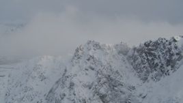 4K aerial stock footage snow covered mountain summit, Knik River Valley, Chugach Mountains, Alaska Aerial Stock Footage | AK0001_1569