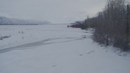 4K aerial stock footage flying over rivers in snow covered Knik River Valley, Alaska Aerial Stock Footage | AK0001_1586