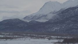 4K aerial stock footage the snow covered Chugach Mountains seen from Knik River Valley, Alaska Aerial Stock Footage | AK0001_1594
