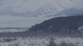 4K aerial stock footage the snow covered Knik Glacier seen from Knik River Valley, Alaska Aerial Stock Footage | AK0001_1596