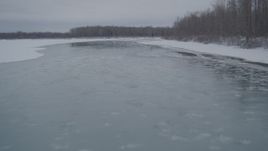 4K aerial stock footage following an icy river, Knik River Valley, Alaska in snow Aerial Stock Footage | AK0001_1600