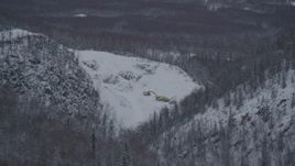4K aerial stock footage snow covered quarry and digging equipment, Chugiak, Alaska Aerial Stock Footage | AK0001_1625