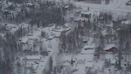 4K aerial stock footage a snowy neighborhood on Old Glenn Highway, Chugiak, Alaska Aerial Stock Footage | AK0001_1627