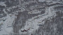 4K aerial stock footage approaching Eagle River, snow covered, residential neighborhoods, Alaska Aerial Stock Footage | AK0001_1632