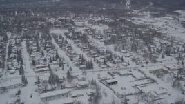 4K aerial stock footage flying over Eagle River residential neighborhoods, covered in snow, Alaska Aerial Stock Footage | AK0001_1633