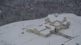 4K aerial stock footage approaching a church in snow covered Eagle River, Alaska Aerial Stock Footage | AK0001_1634
