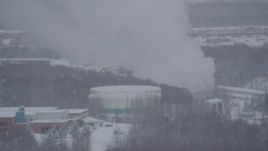 4K aerial stock footage orbiting a snow covered power plant in Anchorage, Alaska Aerial Stock Footage | AK0001_1641