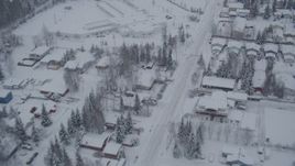 4K aerial stock footage flying over snow covered residential neighborhoods, Anchorage, Alaska Aerial Stock Footage | AK0001_1643