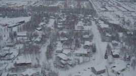 4K aerial  video flying over snowy neighborhoods and mobile home parks, Anchorage, Alaska Aerial Stock Footage | AK0001_1644