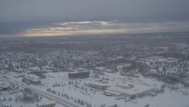 4K aerial stock footage flying by snow covered neighborhoods, mobile home park, Anchorage, Alaska Aerial Stock Footage | AK0001_1645
