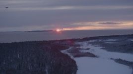 4K aerial stock footage the twilight and clouds seen from snow covered Point MacKenzie, Alaska Aerial Stock Footage | AK0001_1682