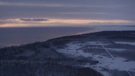 4K aerial stock footage twilight lit clouds, forests on snow covered Point MacKenzie, Alaska Aerial Stock Footage | AK0001_1688
