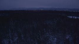 4K aerial stock footage revealing Downtown Anchorage skyline, winter, Point MacKenzie, Alaska, night Aerial Stock Footage | AK0001_1716