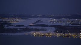 4K aerial stock footage snow covered Elmendorf Air Force Base at night, Anchorage, Alaska Aerial Stock Footage | AK0001_1719