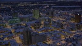 4K aerial stock footage orbiting snow covered Downtown Anchorage at night, Alaska Aerial Stock Footage | AK0001_1722