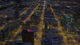 4K aerial stock footage flying over snow covered Downtown Anchorage at night, Alaska Aerial Stock Footage | AK0001_1728