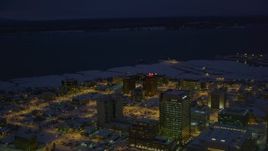 4K aerial stock footage snow covered Downtown Anchorage, Knik Arm of the Cook Inlet at night, Alaska Aerial Stock Footage | AK0001_1730