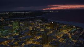 4K aerial stock footage flyby snow covered Downtown Anchorage at night, Alaska Aerial Stock Footage | AK0001_1732