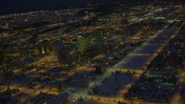 4K aerial stock footage snow covered Downtown Anchorage and Merrill Field at night, Alaska Aerial Stock Footage | AK0001_1735
