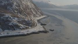 4K aerial stock footage approaching Seward Highway on the snowy shore of the Turnagain Arm, Alaska Aerial Stock Footage | AK0001_1741